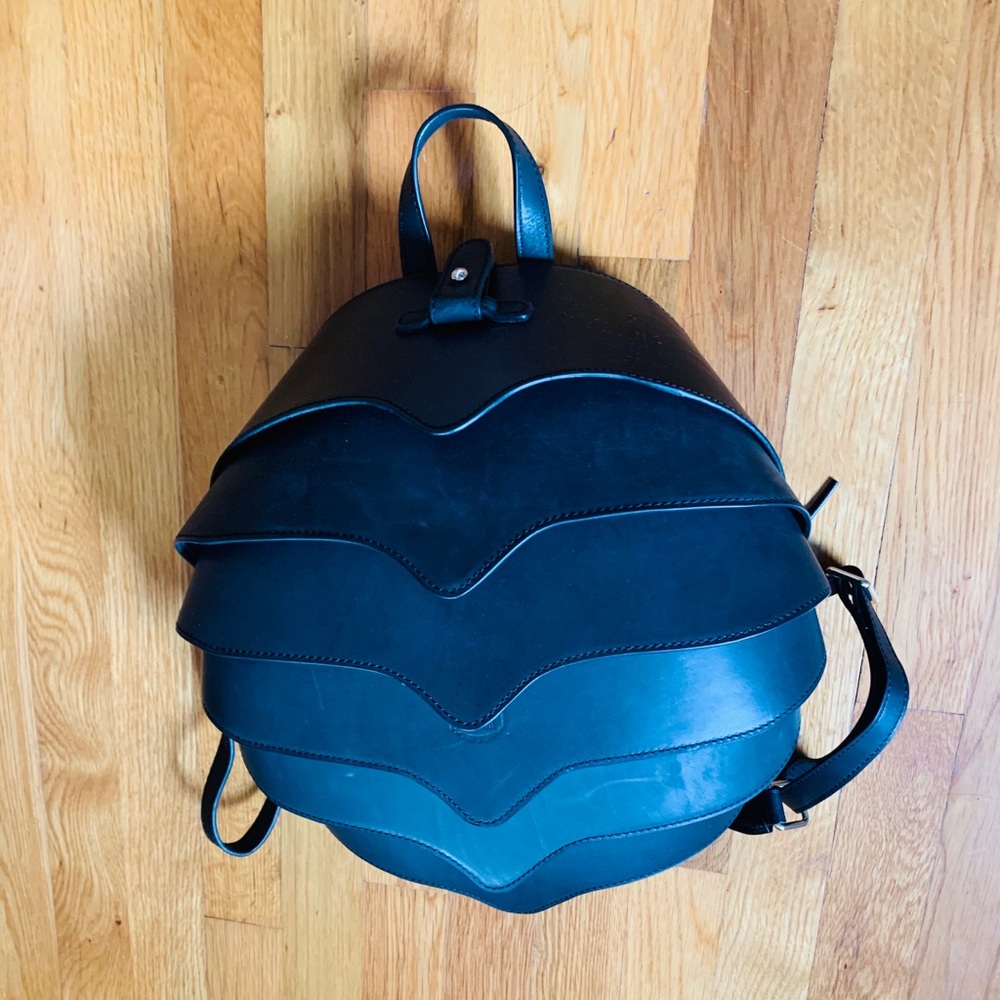 Handmade leather beetle bag.